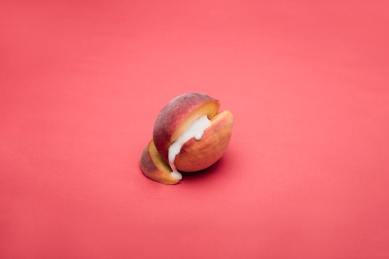 sliced apple fruit on pink surface