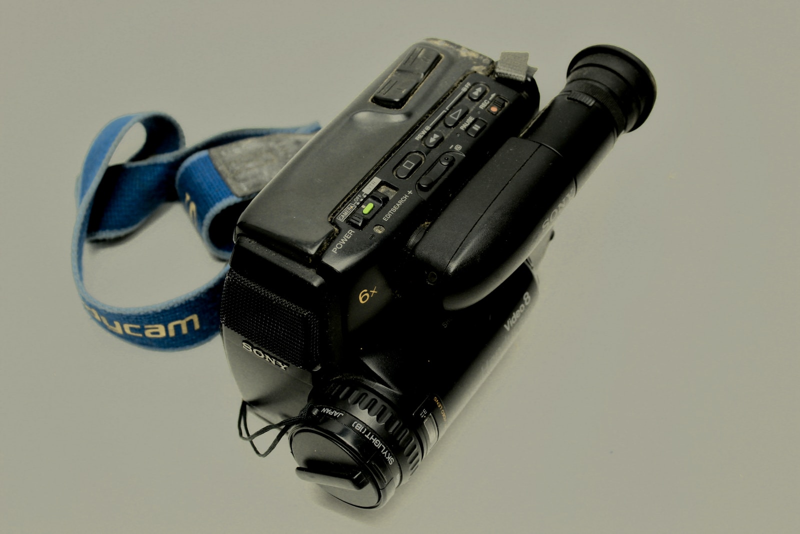 a camera with a strap attached to it