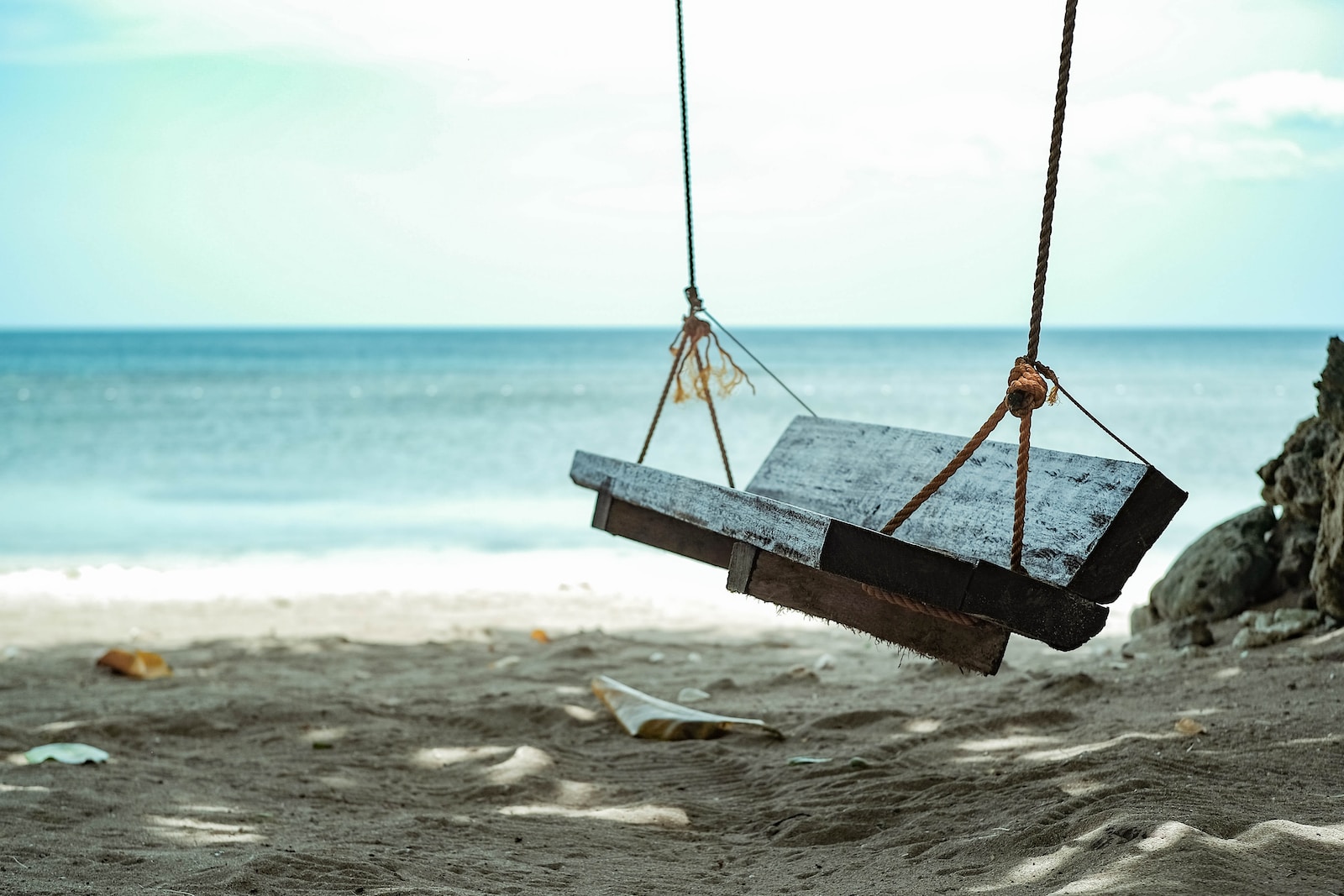 brown wooden swing seat